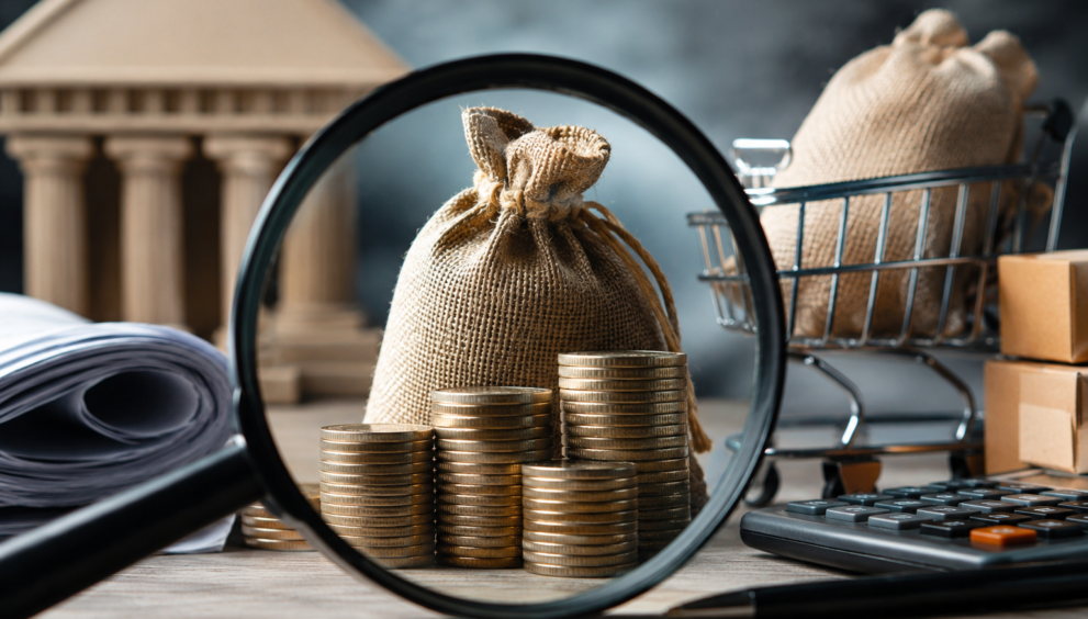 Illustration representing the investigation into fake GST Input Tax Credit fraud in India with financial documents, coins, and a magnifying glass.